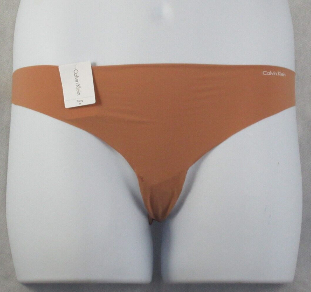 Calvin Klein Women’s Invisibles Thong Panty Underwear, Light Brown, Medium