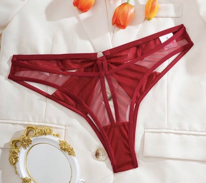 Women’s red panties with a sexy design featuring front and back cutouts. Size M