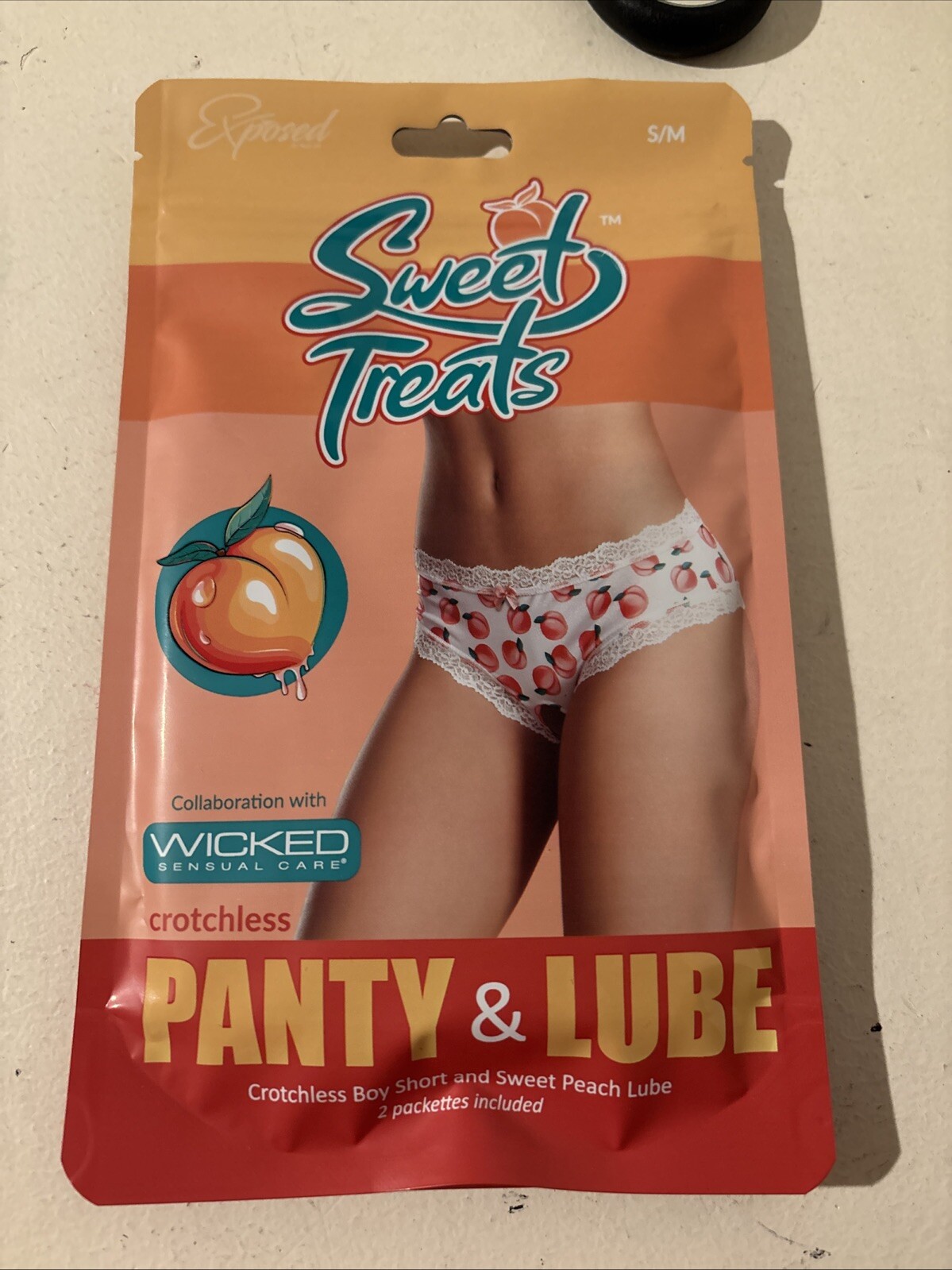 SWEET TREATS SPLIT BACK CROTCHLESS PANTY WITH EDIBLE LUBE PEACH