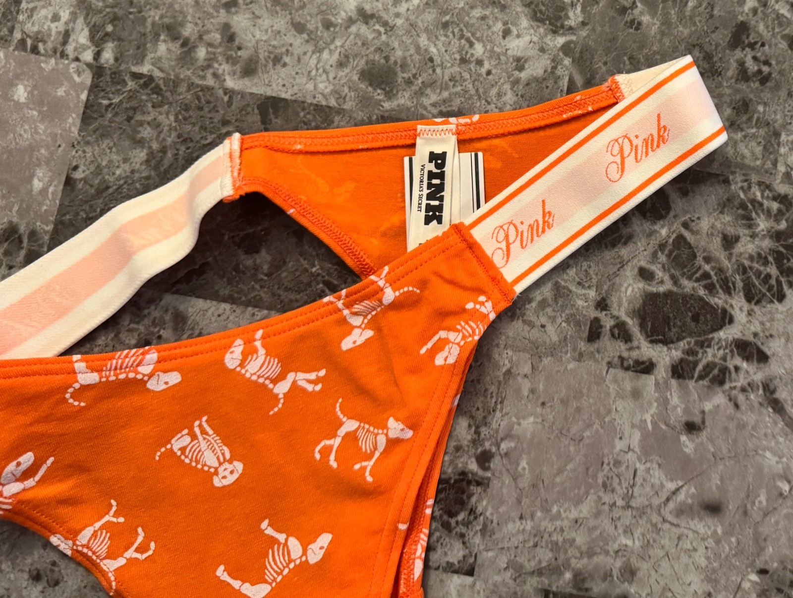NWT VICTORIA’S SECRET PINK ORANGE WHITE SKELETON DOG HALLOWEEN THONG PANTIES