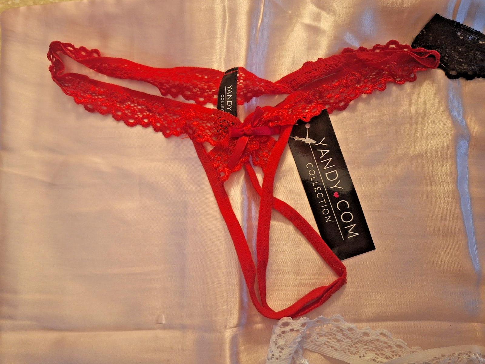 Yandy crotchless lace thongs in red, black, white (One size) Lot of (3)