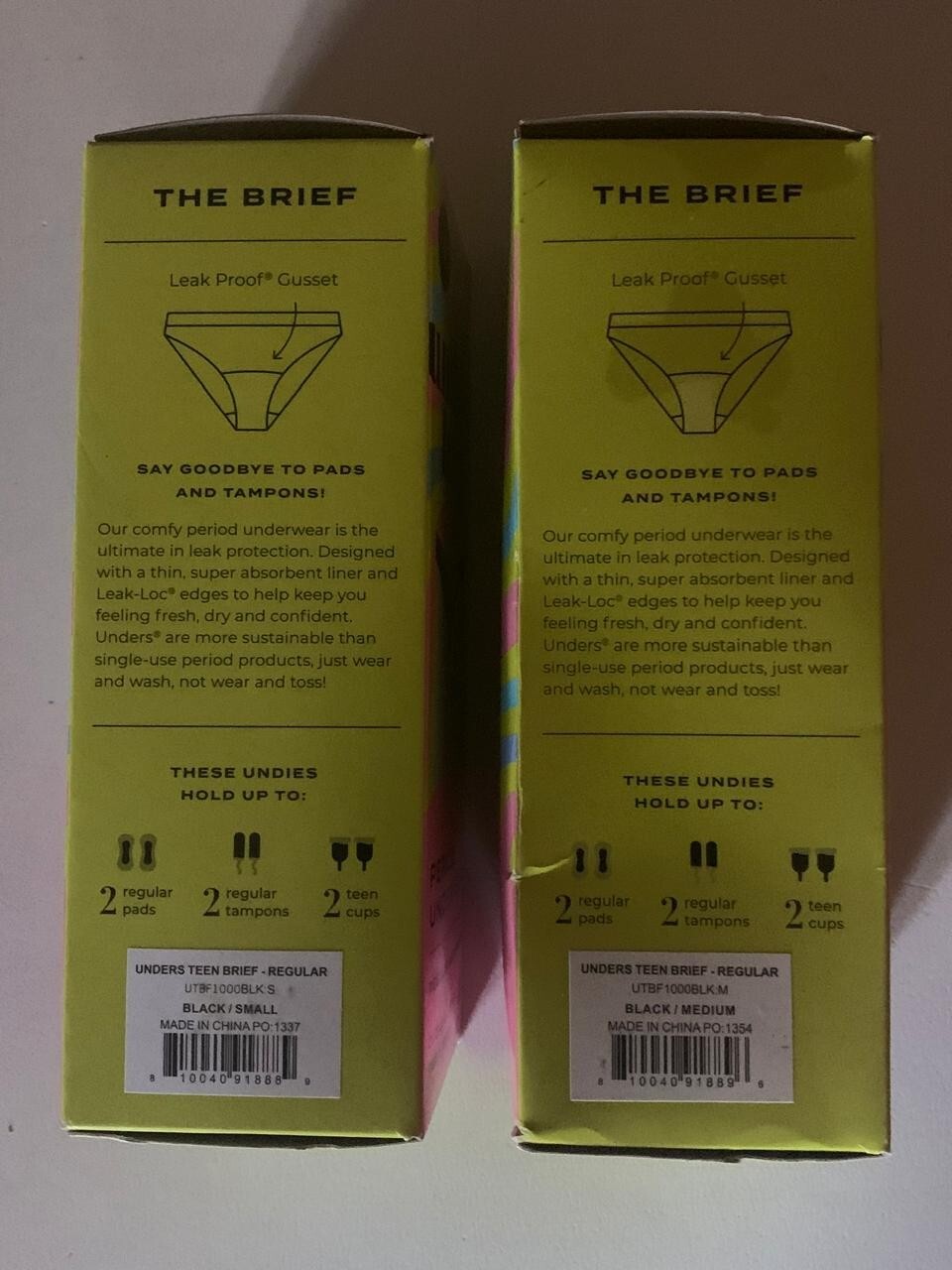 Lot of 2, Unders Teen Brief Regular black small & medium. Slightly damaged box.