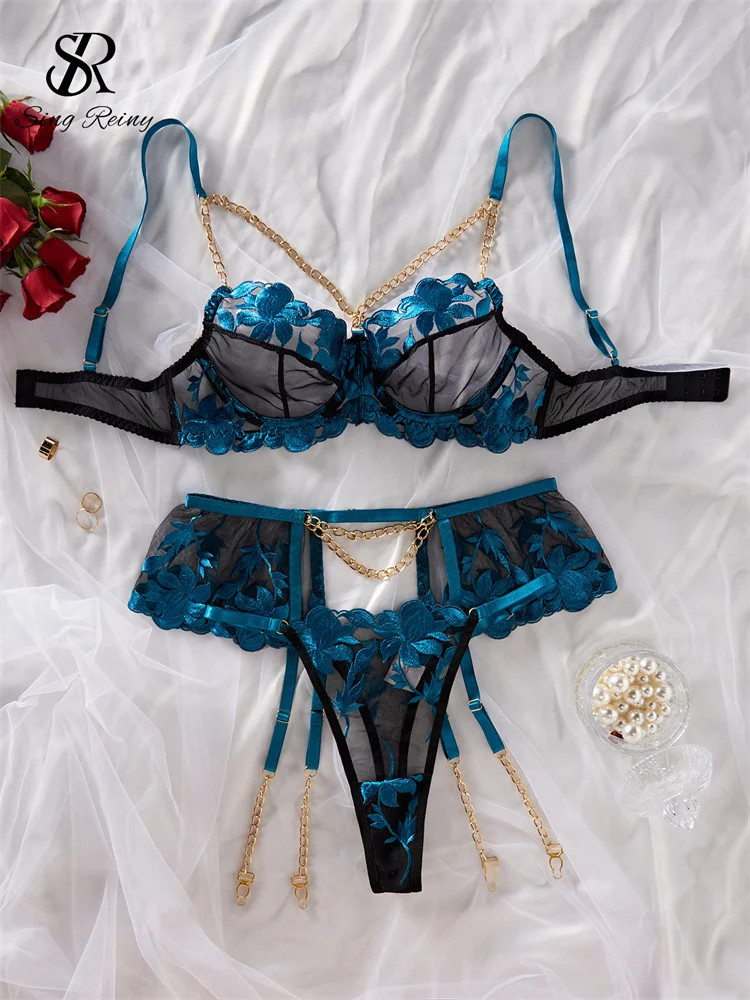 three-piece set with embroidered floral design.