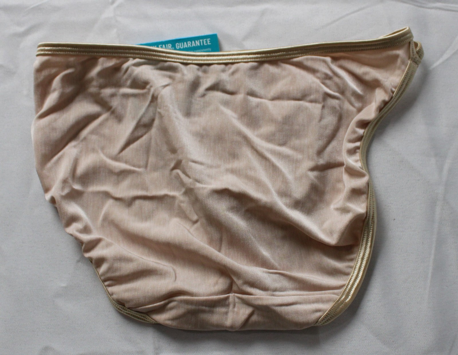 Vanity Fair Women’s Illumination String Bikini Panties AC2 Beige Size: 5 (Small)