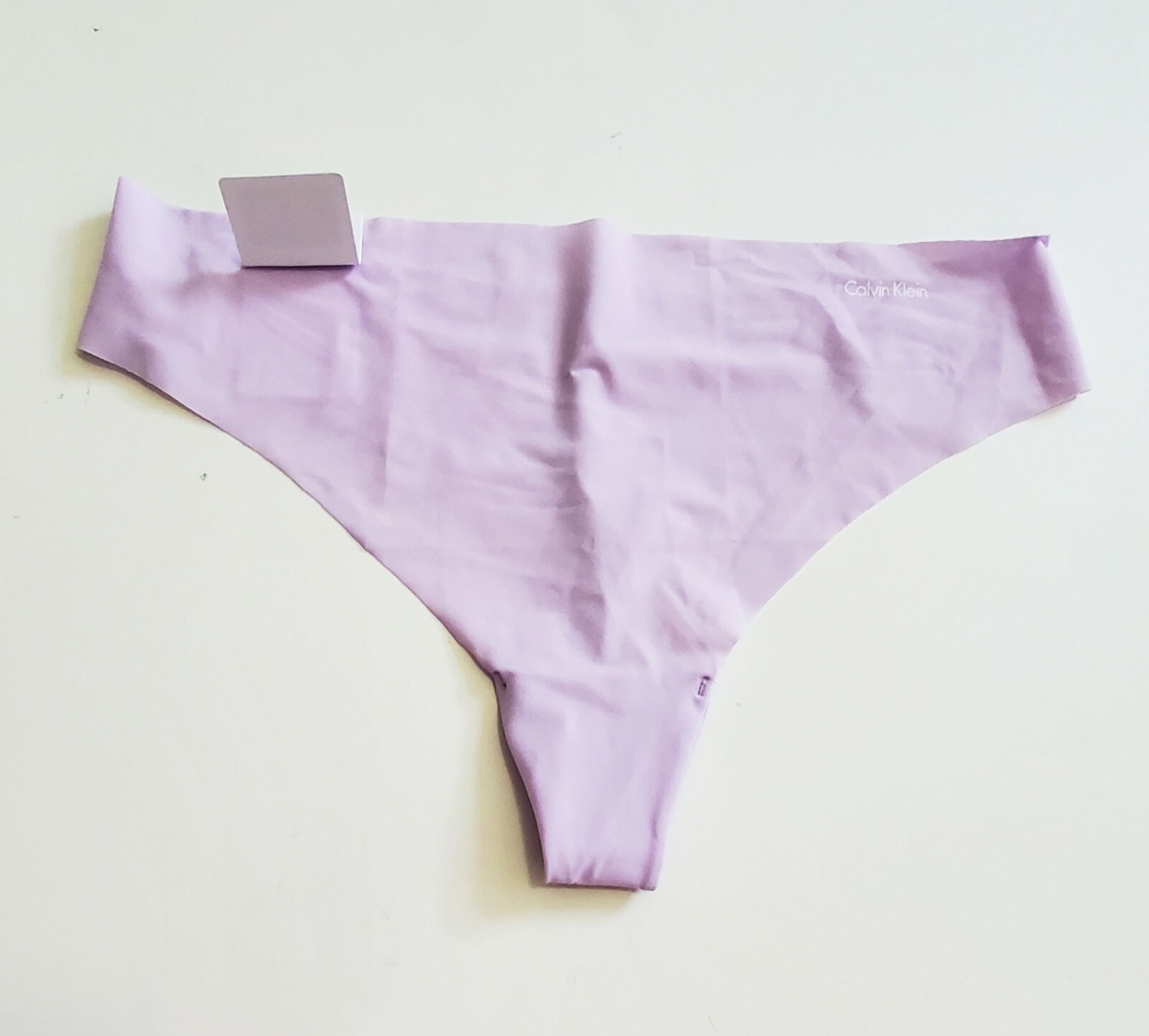 3 Calvin Klein Invisible Thong Panty Ambiant Lavendar D3428 Sz L – NWT
