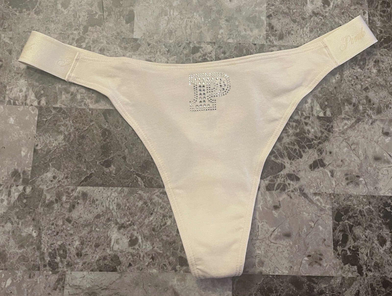 NWT VICTORIA’S SECRET PINK IVORY RHINESTONE THICK LOGO SIDE STRAP THONG PANTIES