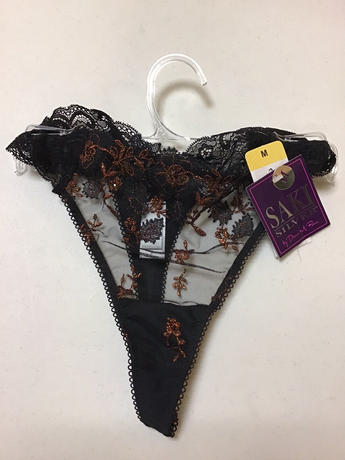 WOMENS PANTY SAKI SILVER STRING THONG BLACK LACE WITH BRONZE COLOR DESIGN