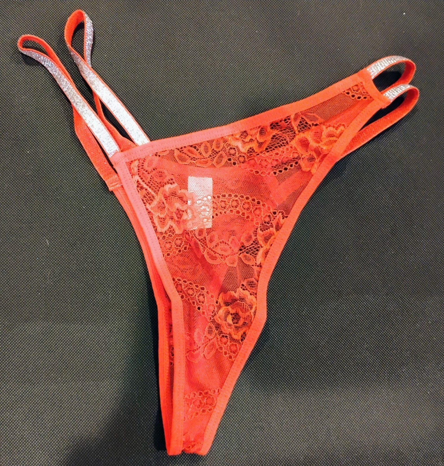 Red lace fabric with silver tone trim – Thong (L)